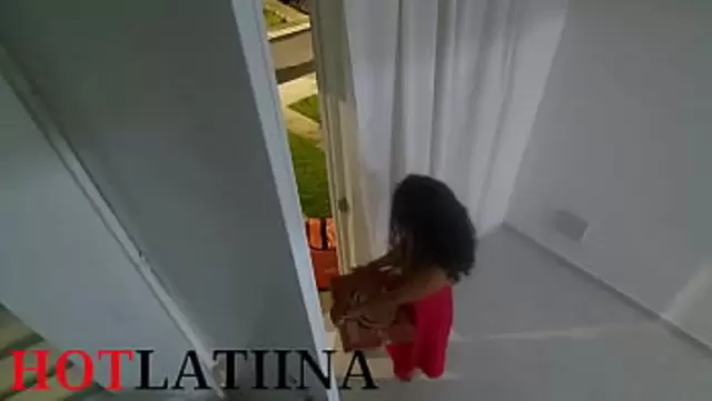 A resident of Barnaullah exposes her breasts to a courier